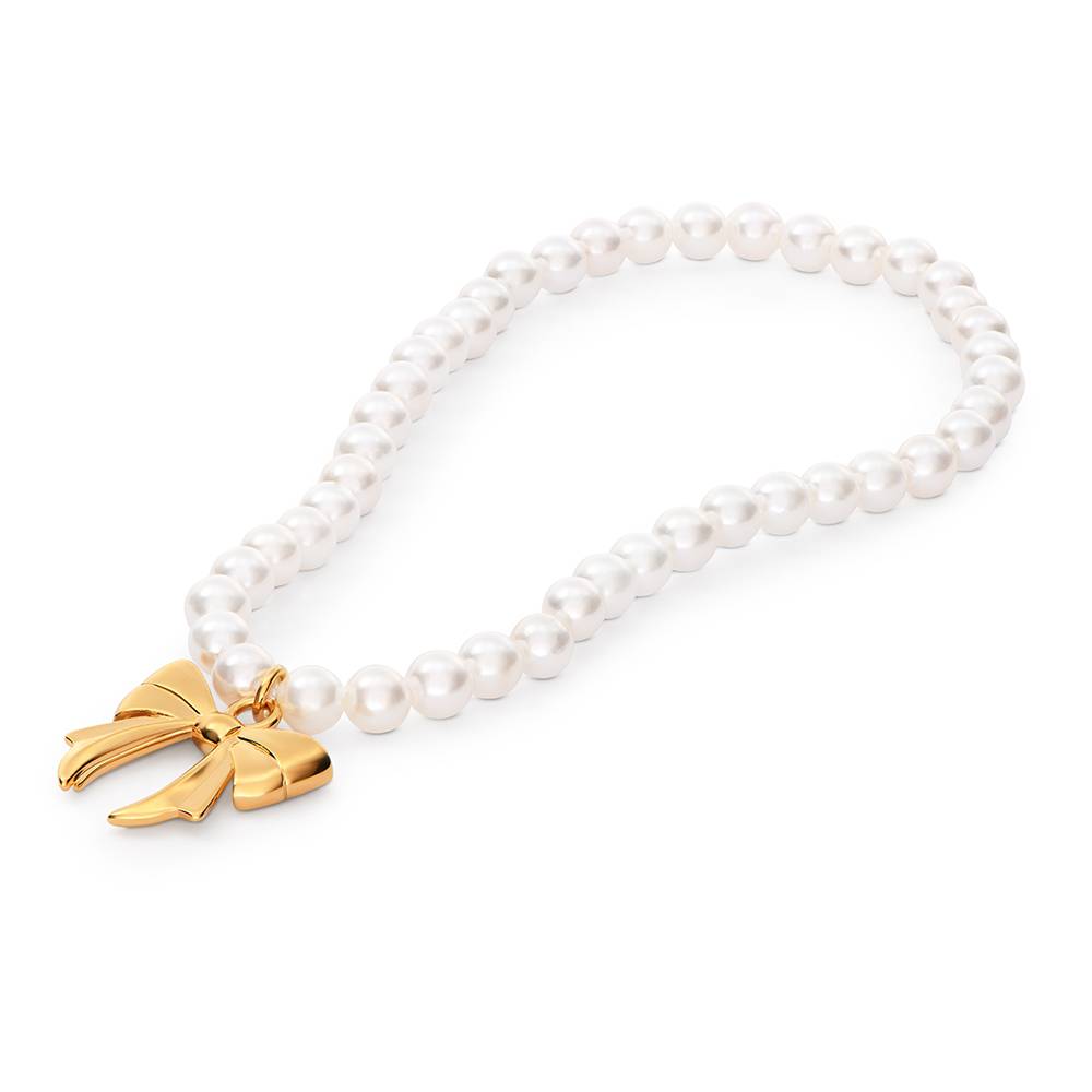 The Petite Pearl Bow Bracelet in Gold Plating-2 The Petite Pearl Bow Bracelet in Gold Plating-2 product photo